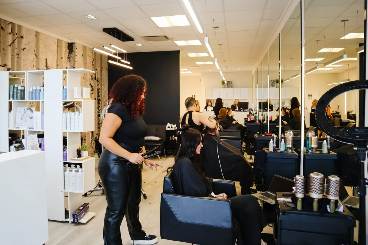 Stylists at work on the salon floor at Clique Organic Salons in Kitchener