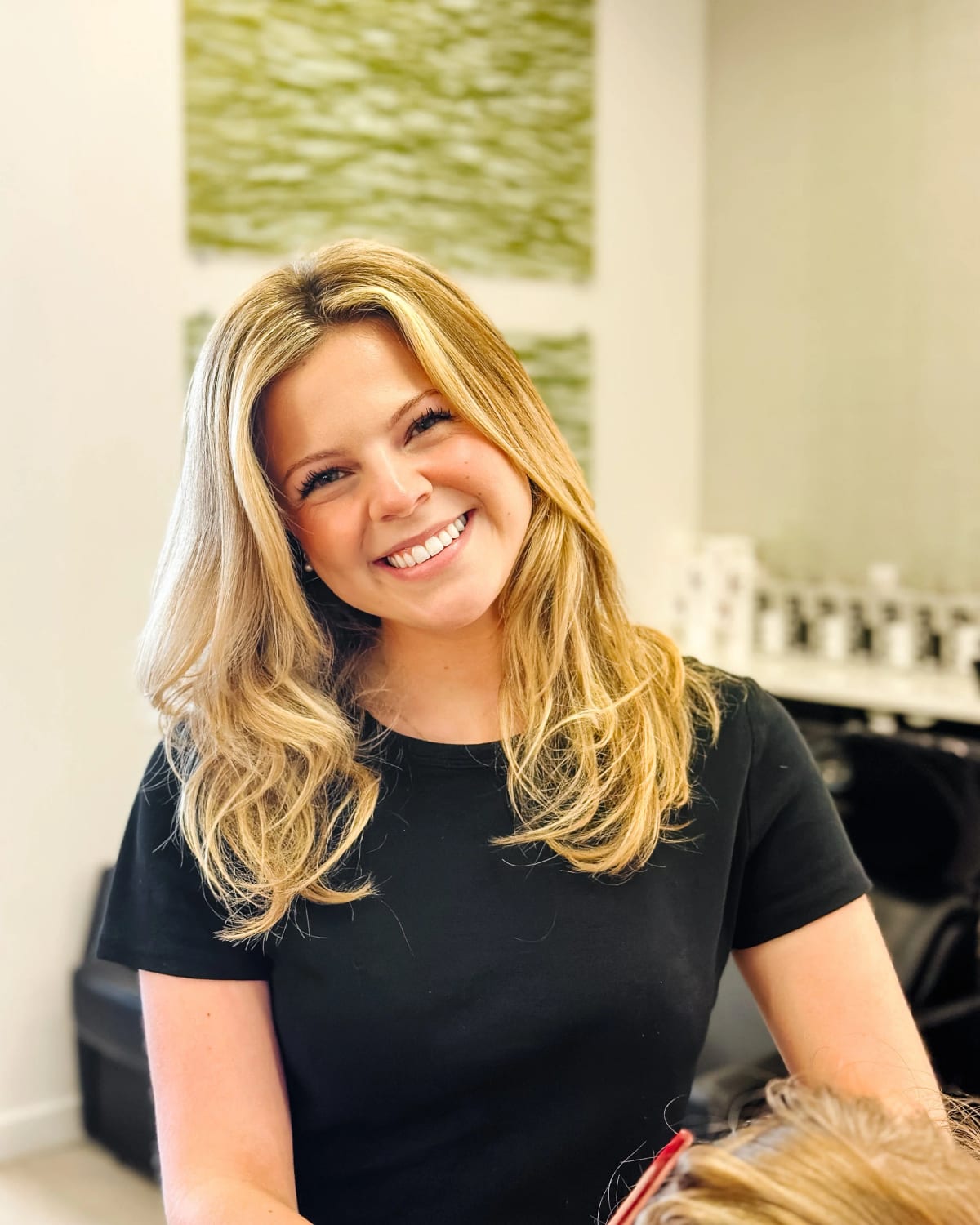 Carly Webster, salon level stylist at Clique Organic Salons